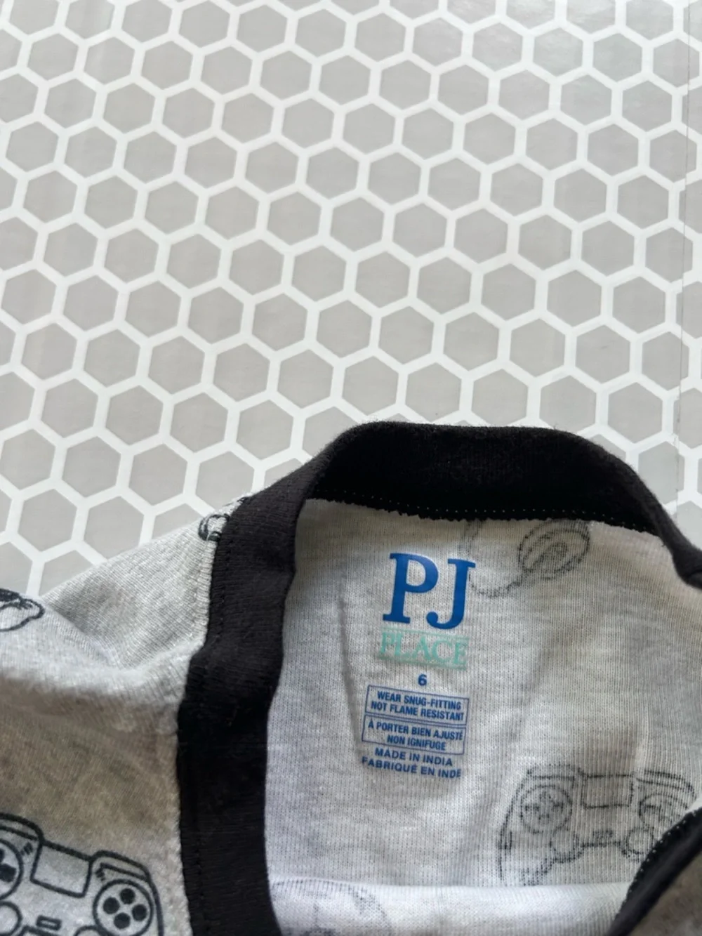 Place Grey Pajama Set with Black Accents and Game Print. Size 6